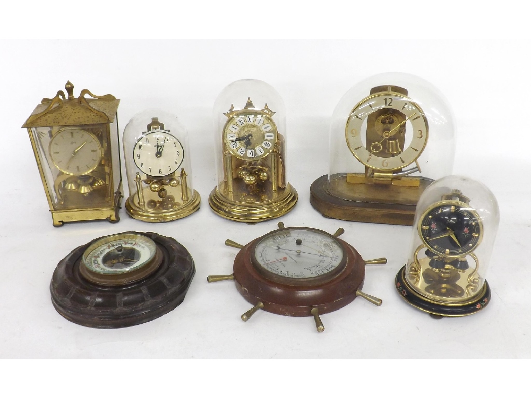 Appraisal: Five various torsion clocks also two small circular wall barometers