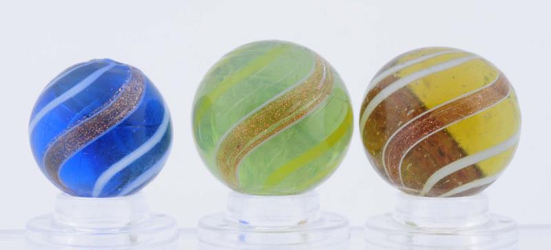 Appraisal: Lot Of Colored Glass Banded Lutz Marbles Lot includes a