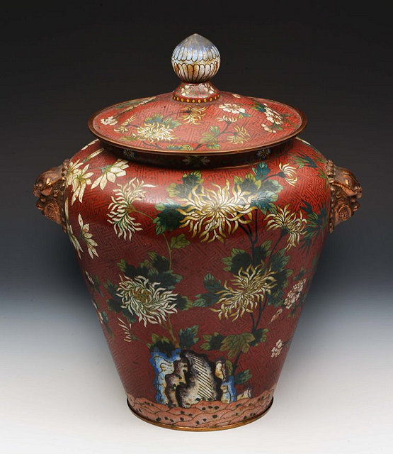 Appraisal: A CHINESE RED GROUND CLOISONNE VASE and cover decorated with