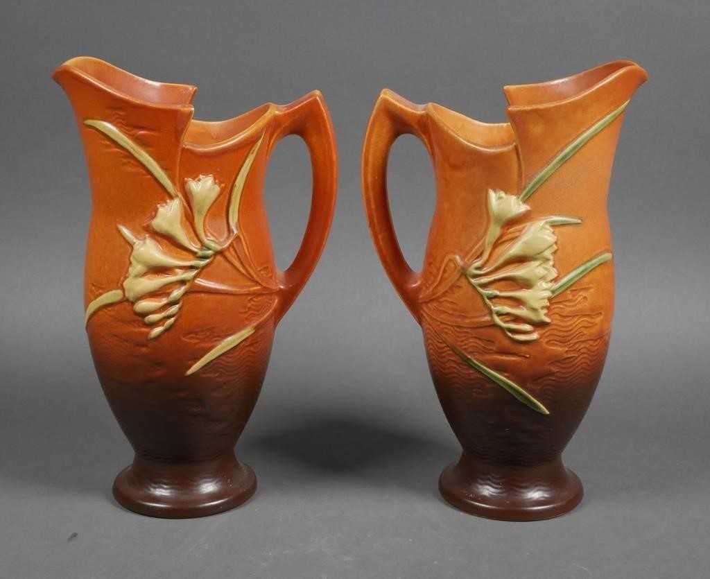 Appraisal: Pair Roseville Freesia art pottery pitchers Marked on the bottoms