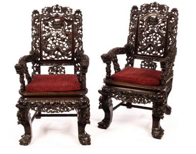 Appraisal: A pair of th Century Chinese hardwood armchairs the whole