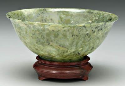 Appraisal: Chinese hardstone bowl mottled green with natural inclusions wooden stand