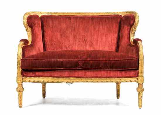 Appraisal: A Louis XVI Style Giltwood Settee having stylized foliate carved