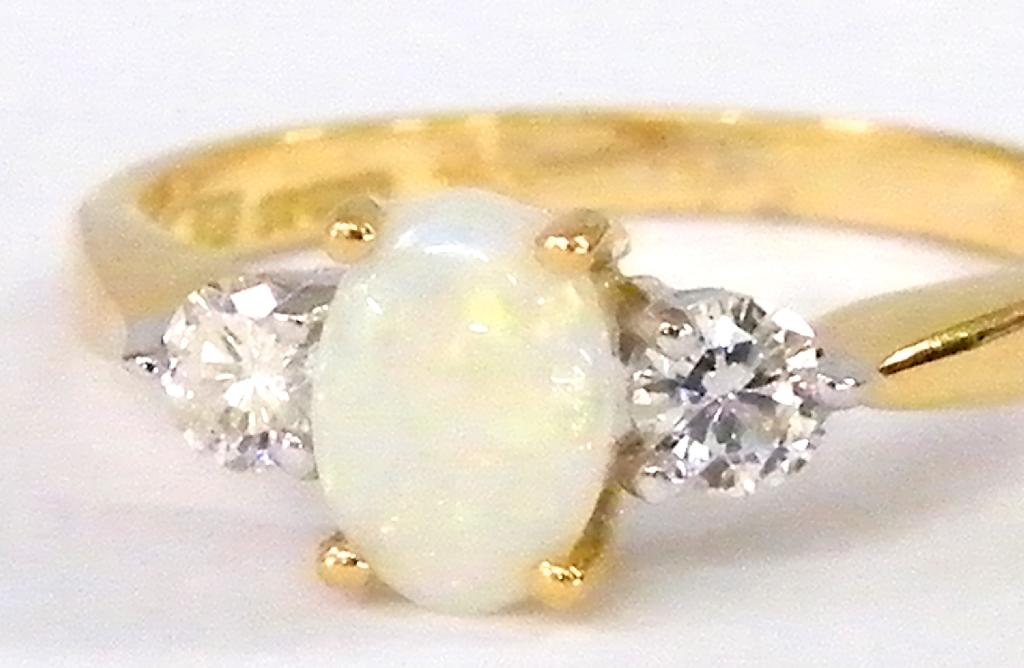 Appraisal: Attractive ct opal and diamond three stone ring diamonds ct