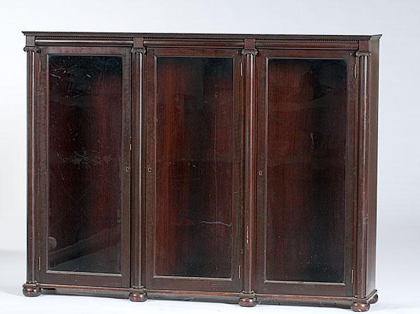 Appraisal: MAHOGANY THREE-PART BOOKSHELVES WITH GLAZED DOORS An American mahogany three-part