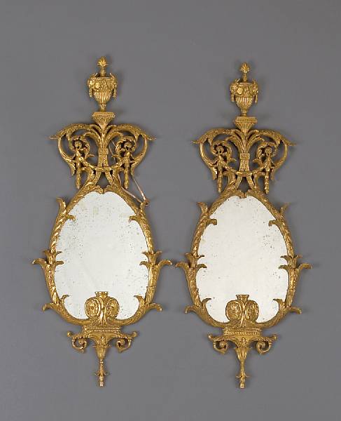 Appraisal: A pair of George III style carved giltwood mirrors Each