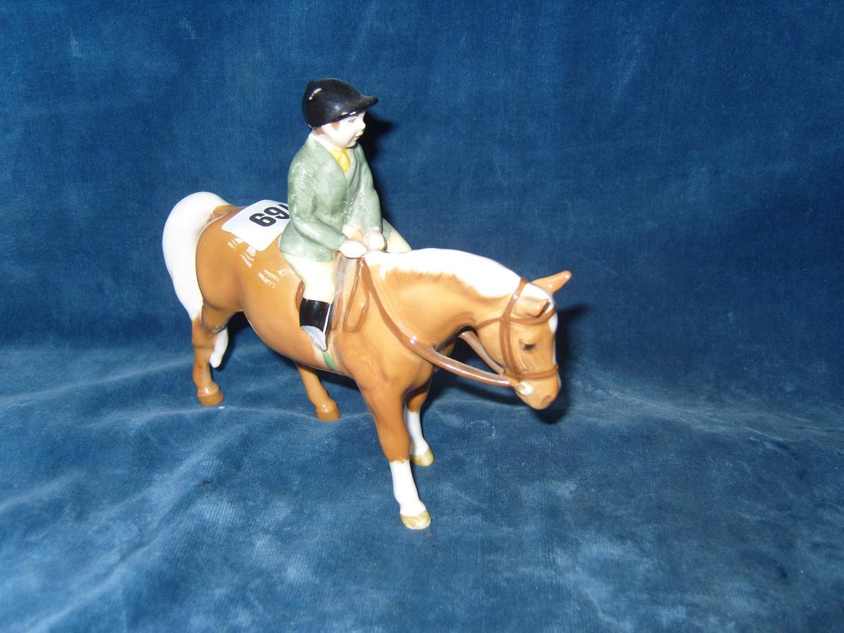 Appraisal: A Beswick model of a child in green hunting jacket