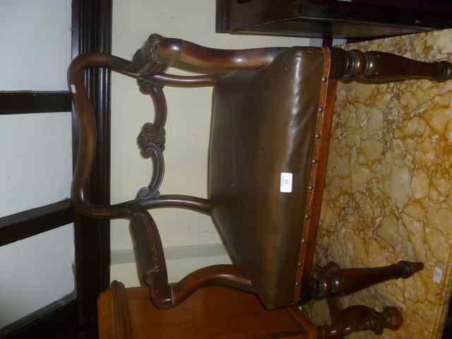 Appraisal: A REGENCY MAHOGANY BALLOON BACK ELBOW CHAIR with carved splat