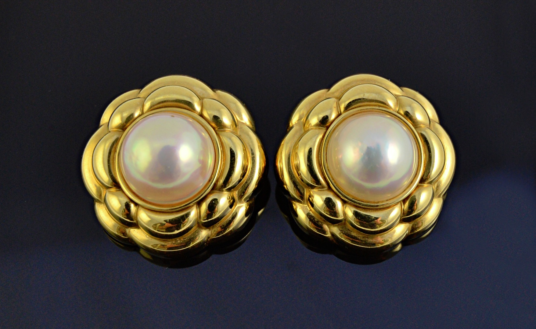 Appraisal: A pair of gold and mabe pearl earclips each of