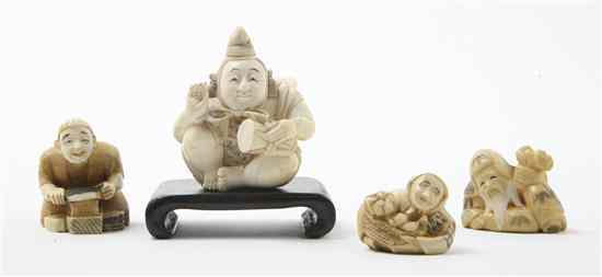 Appraisal: A Collection of Four Ivory Netsuke comprising a seated figure