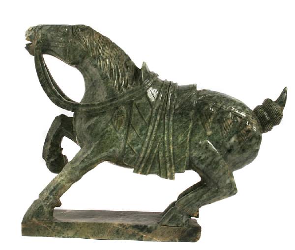 Appraisal: A green hardstone carving of a horse height in width