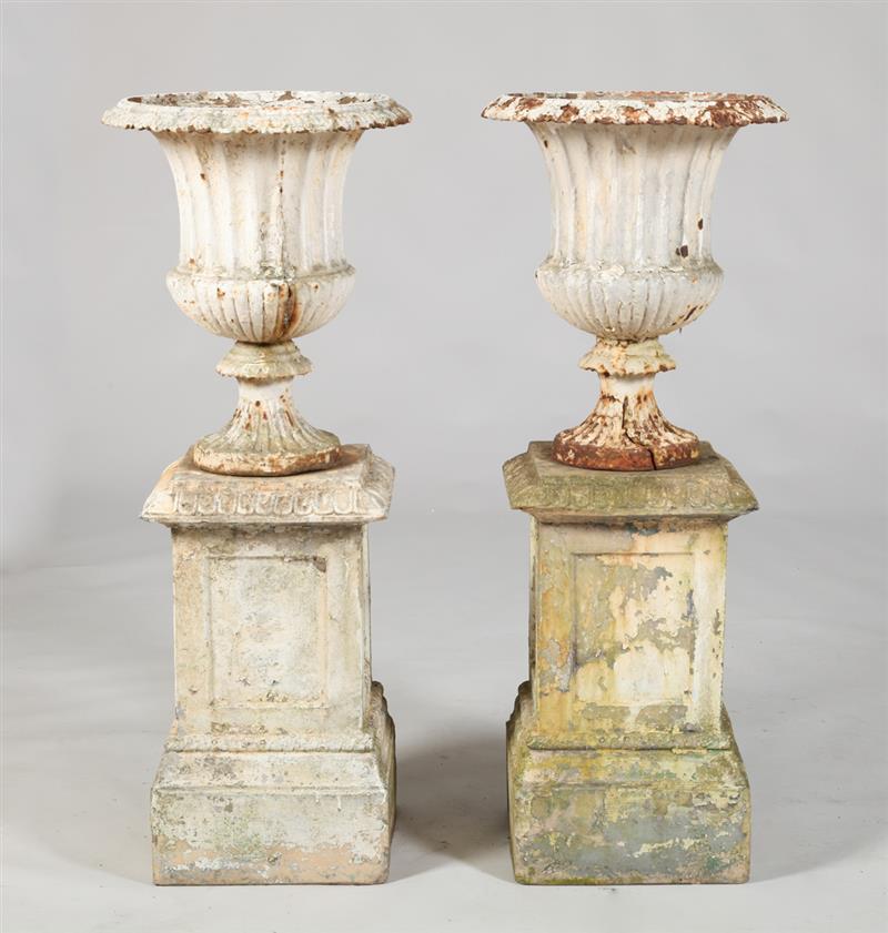 Appraisal: PAIR OF PAINTED CAST-IRON GARDEN URNS Each with an everted