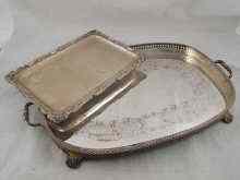 Appraisal: A rectangular silver tray with applied scrolling border marked approx