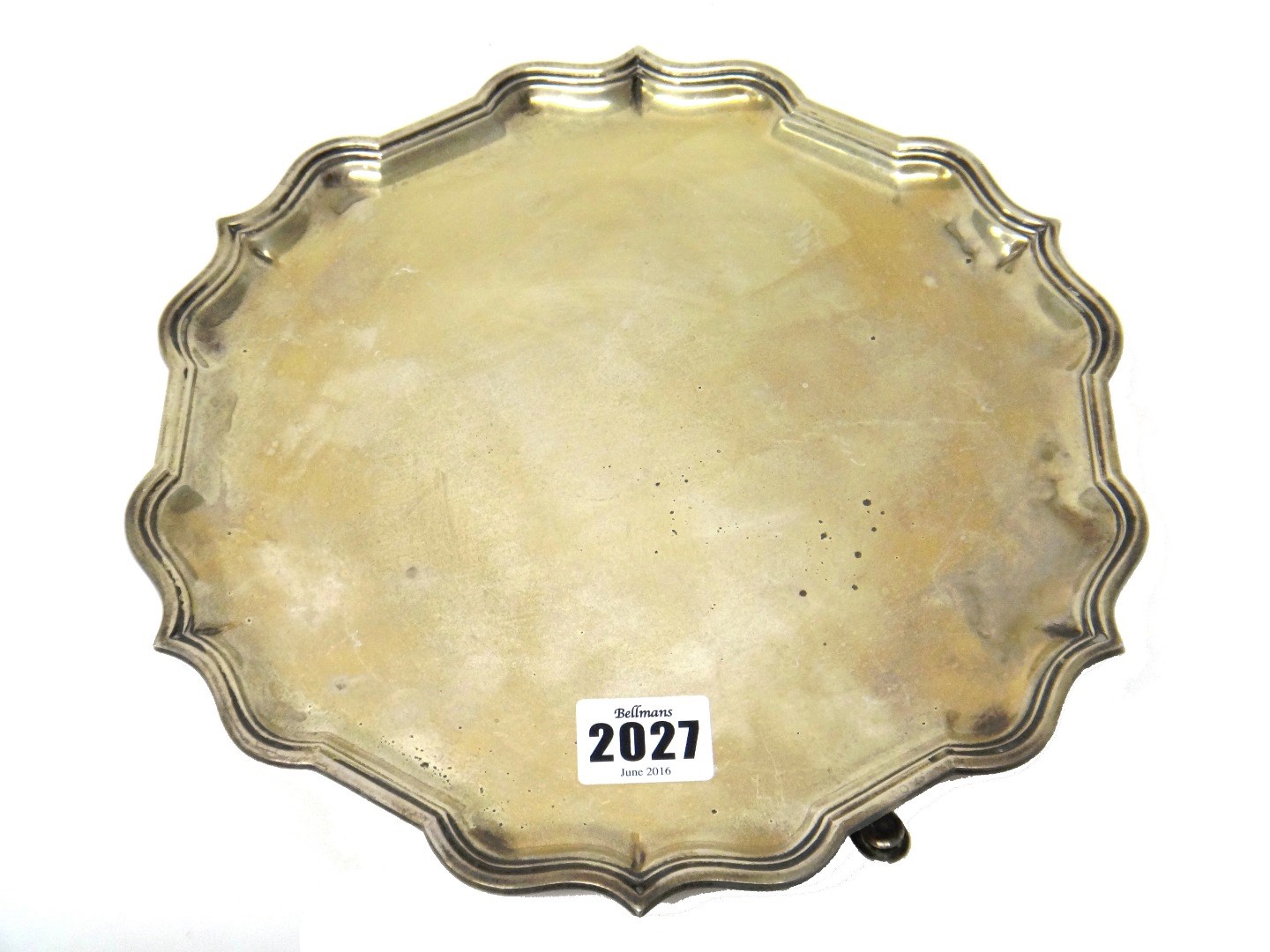 Appraisal: A silver salver of shaped circular form decorated with a