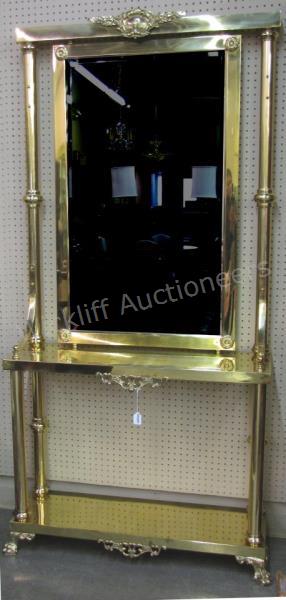 Appraisal: A brass finished decorator quality entry console French period-style with