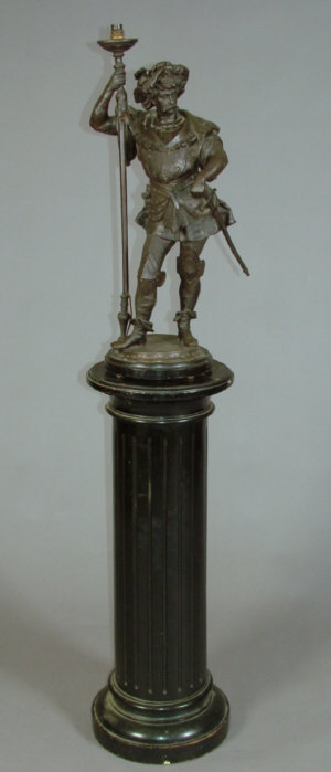 Appraisal: A late th century bronzed spelter lamp base modelled as