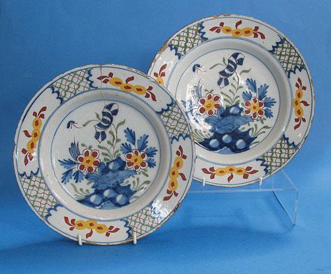 Appraisal: A PAIR OF DELFTWARE POLYCHROME PLATES possibly Liverpool th century