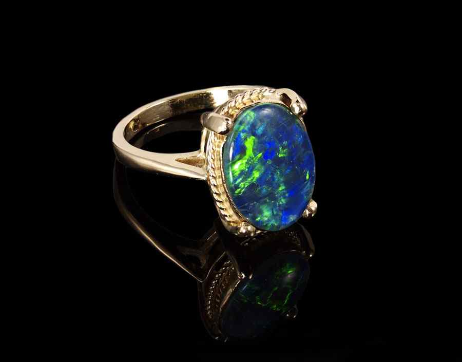 Appraisal: K OPAL TRIPLET RING K yellow gold ring contains one