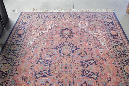 Appraisal: ORIENTAL AREA RUG Salmon and dark blue with triple border