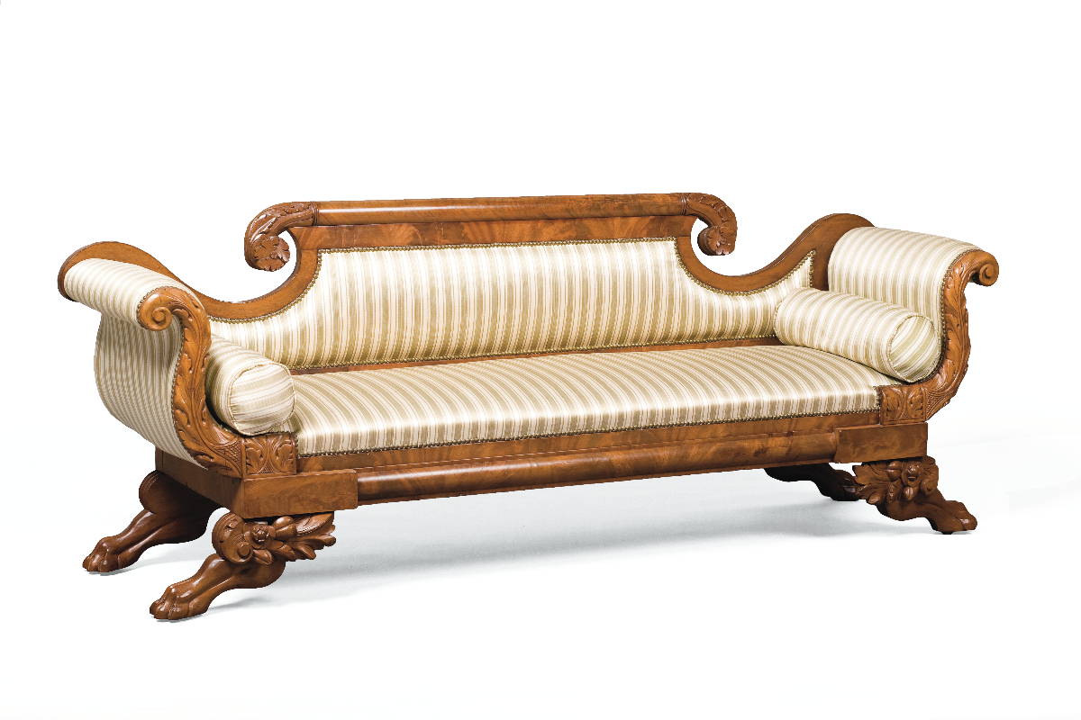 Appraisal: AMERICAN CLASSICAL CARVED MAHOGANY SOFA The foliate and floral-carved scrolled