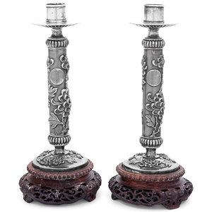 Appraisal: A Pair of Silver Candlesticks th Century each mounted to