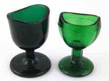 Appraisal: Two moulded green glass eye baths approx cm high