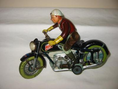 Appraisal: An Arnold MAC motor cyclist marked U S Zone tin