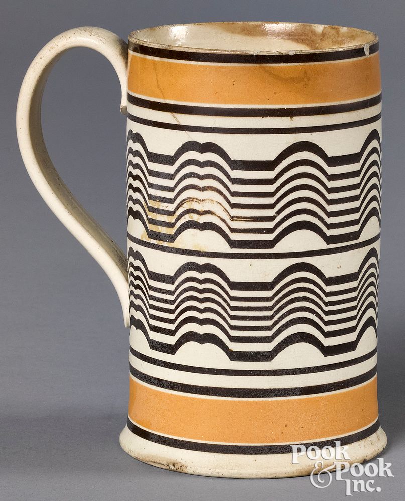 Appraisal: Mocha mug Mocha mug with brown wavy bands with yellow