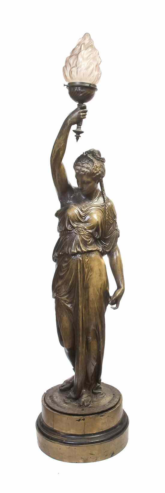 Appraisal: A Neoclassical Style Cast Metal Figural Torchiere depicting a robed