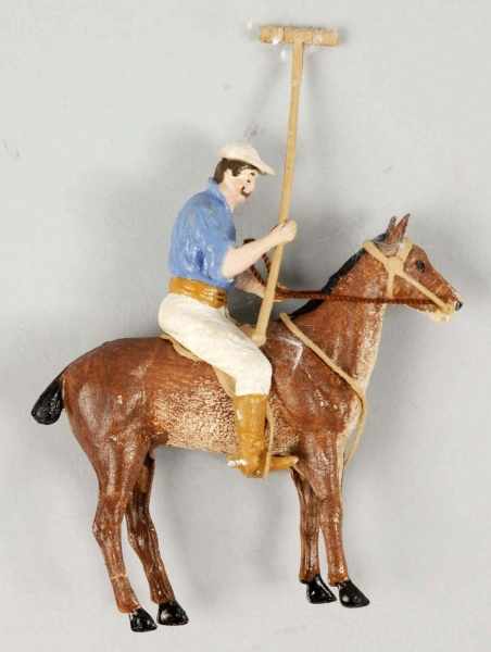 Appraisal: German Dresden Polo Player Christmas Ornament Description Leg creases Condition