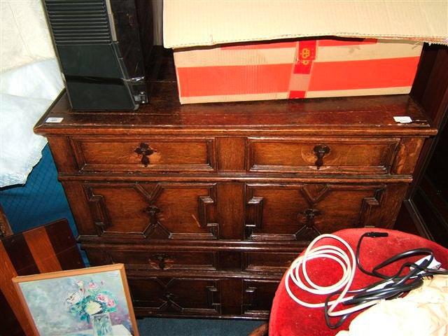 Appraisal: A Jacobean style oak chest of four long drawers standing