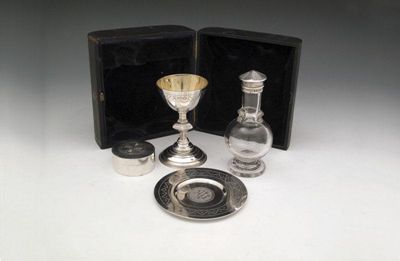 Appraisal: A matched four-piece Victorian silver travelling communion set by Matthew