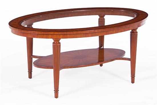 Appraisal: Maitland-Smith inlaid mahogany and glass coffee table oval glass top