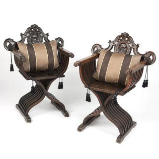 Appraisal: A pair of carved walnut Renaissance revival Savonarola chairs th