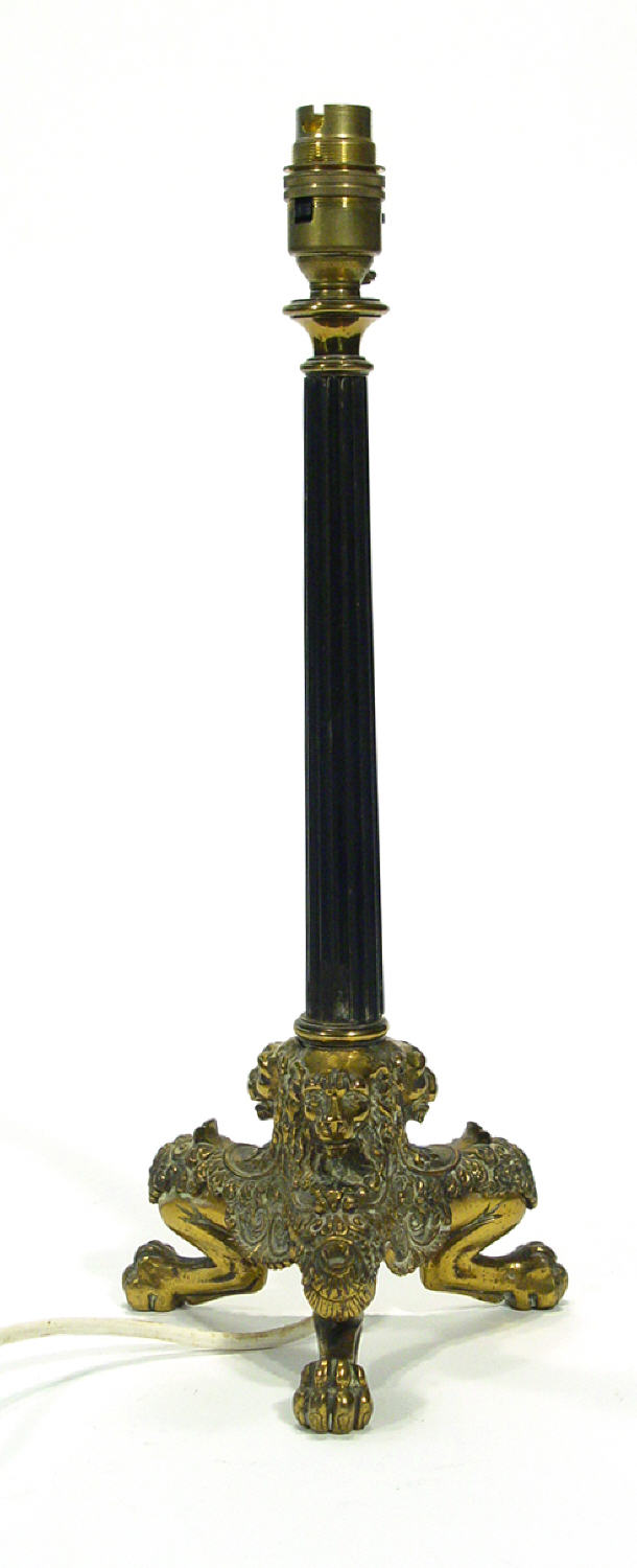 Appraisal: Ebonised wooden and brass table lamp the reeded stem on