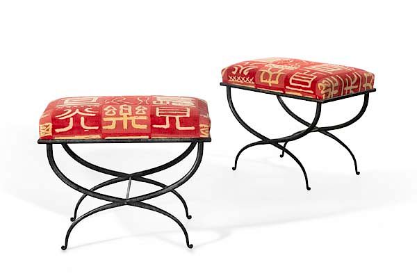 Appraisal: A pair of Pompeiian style wrought iron stools A pair