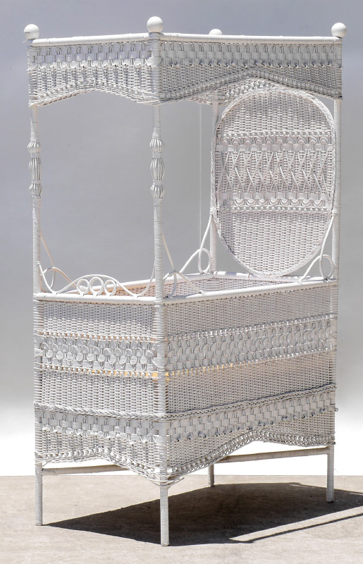 Appraisal: CURLY-Q WHITE WICKER BABY BED Reed and split cane white