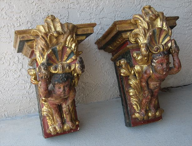 Appraisal: TH C PAIR CARVED GILT WOOD FIGURAL WALL BRACKETS Gold