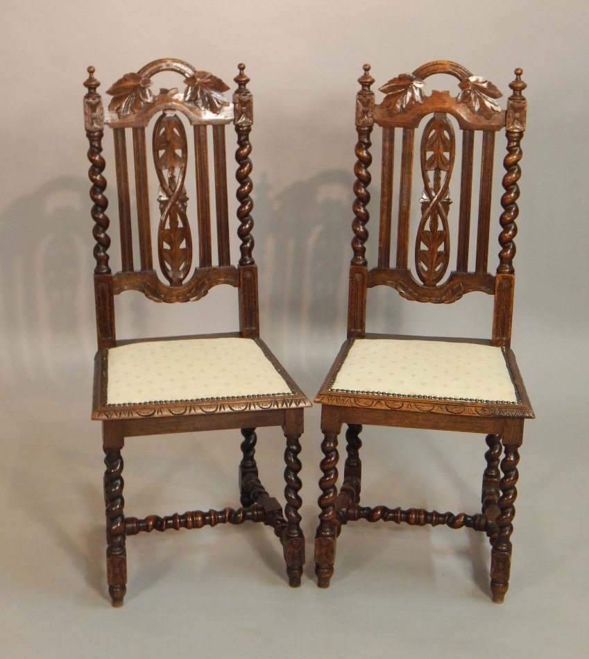 Appraisal: A pair of Victorian carved oak side chairs each with