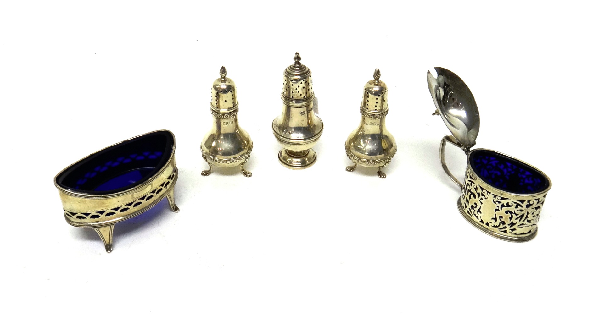 Appraisal: Silver comprising an oval mustard pot with scroll pierced decoration