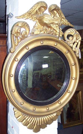 Appraisal: A Regency style convex mirror the circular plate to a