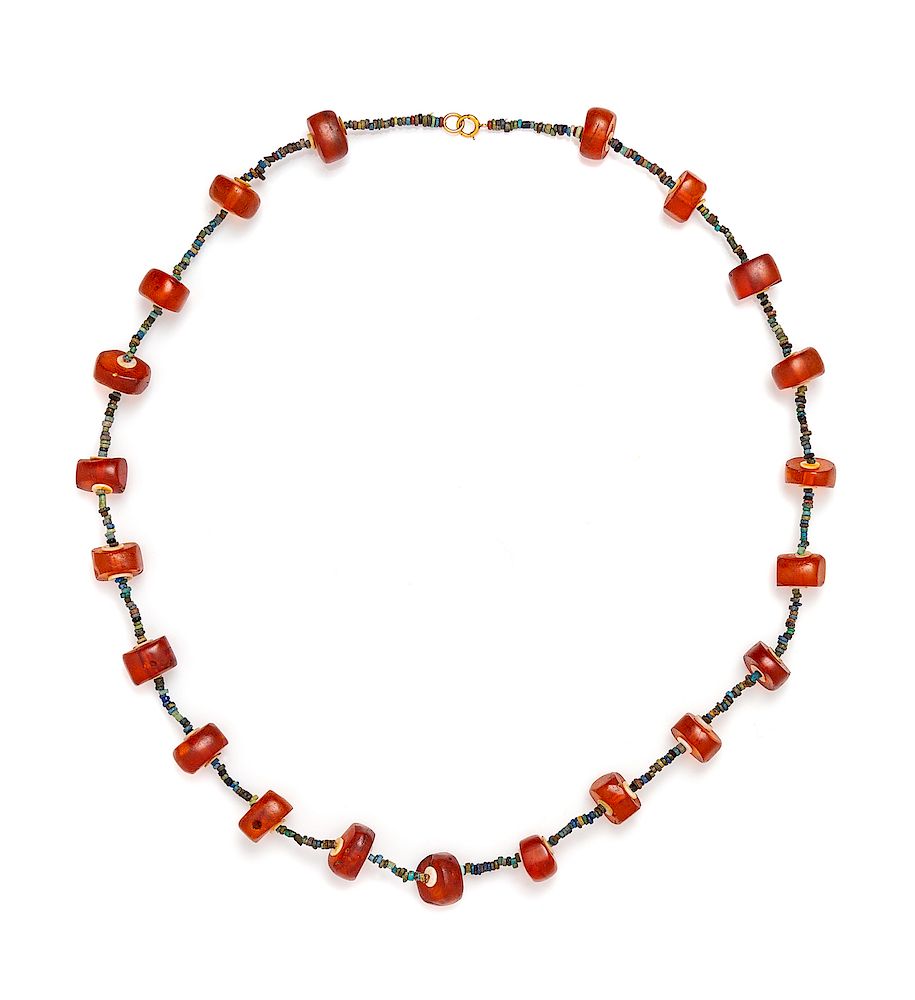 Appraisal: An Egyptian Amber and Faience Beaded Necklace An Egyptian Amber