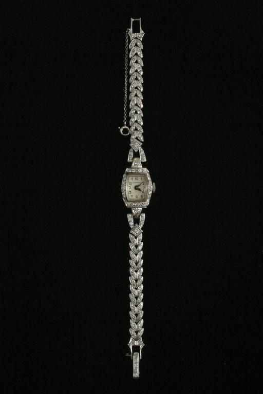 Appraisal: A Perraux Lady's Cocktail Wristwatch with rectangular dial surrounded by