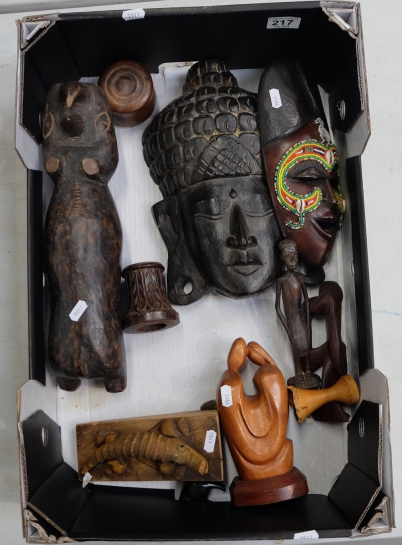 Appraisal: A collection of ethnic carved wood items including face masks