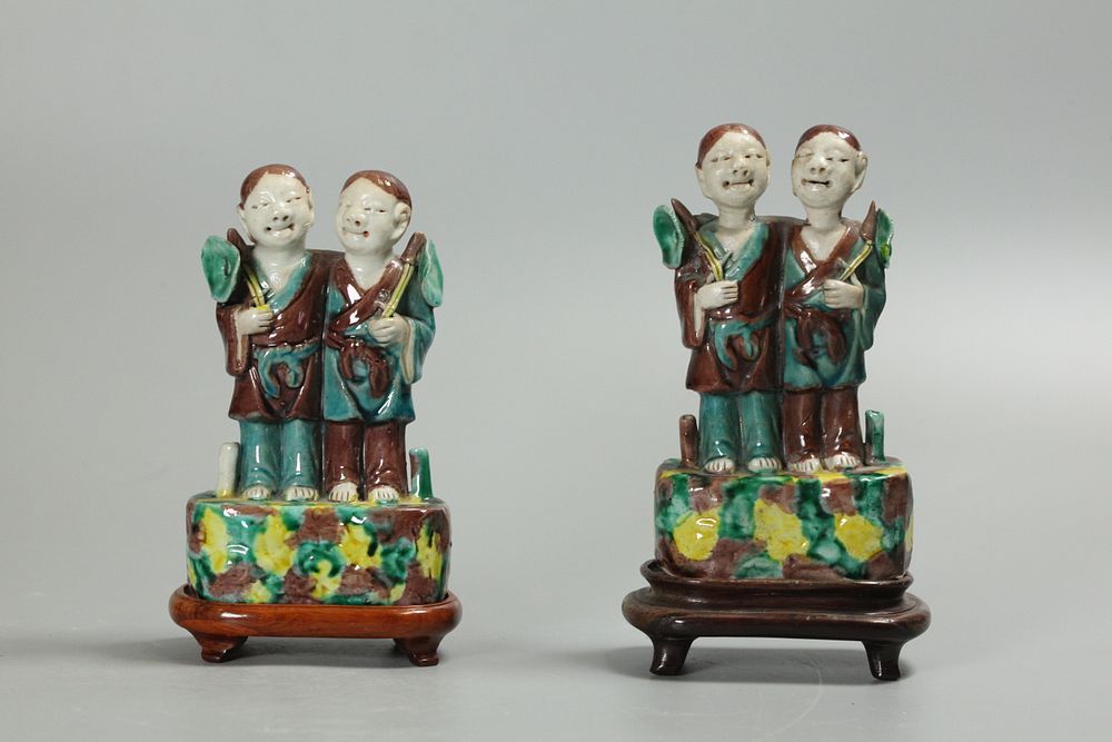 Appraisal: pair of Chinese biscuit-glazed hoho twins possibly th c taller