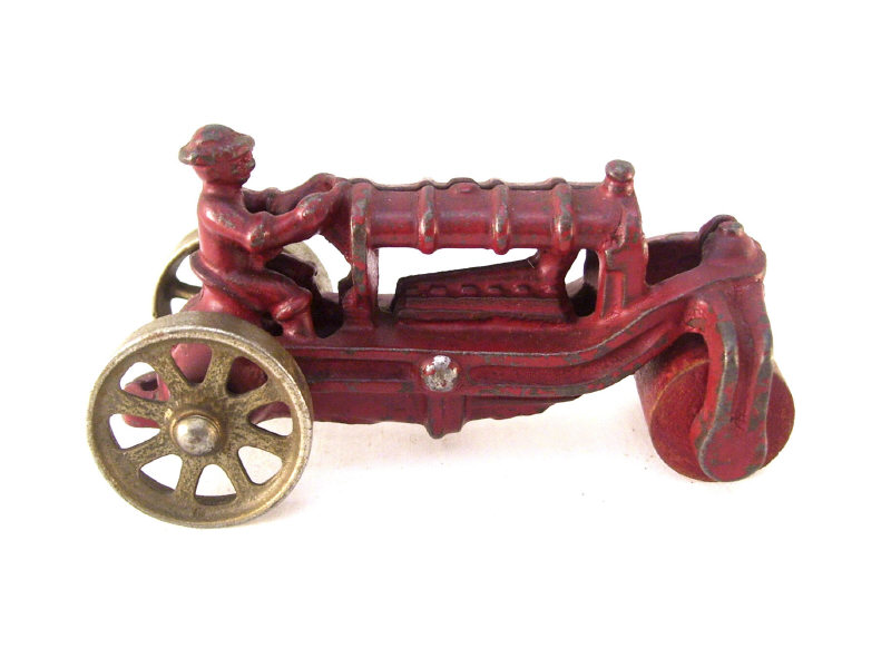 Appraisal: Cast Iron Tractor with Roller Front Original red paint No