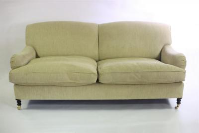 Appraisal: A George Smith two-seater sofa on turned front legs with