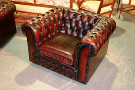 Appraisal: Two single Chesterfield armchairs in brown leather