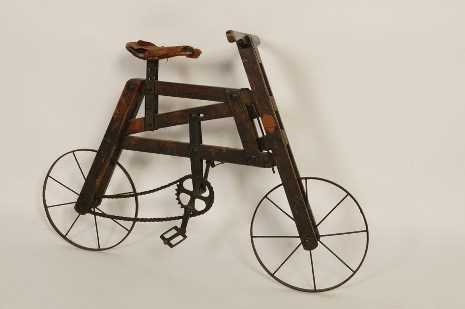 Appraisal: A LATE VICTORIAN STYLE CHILD'S BICYCLE with wooden and metal