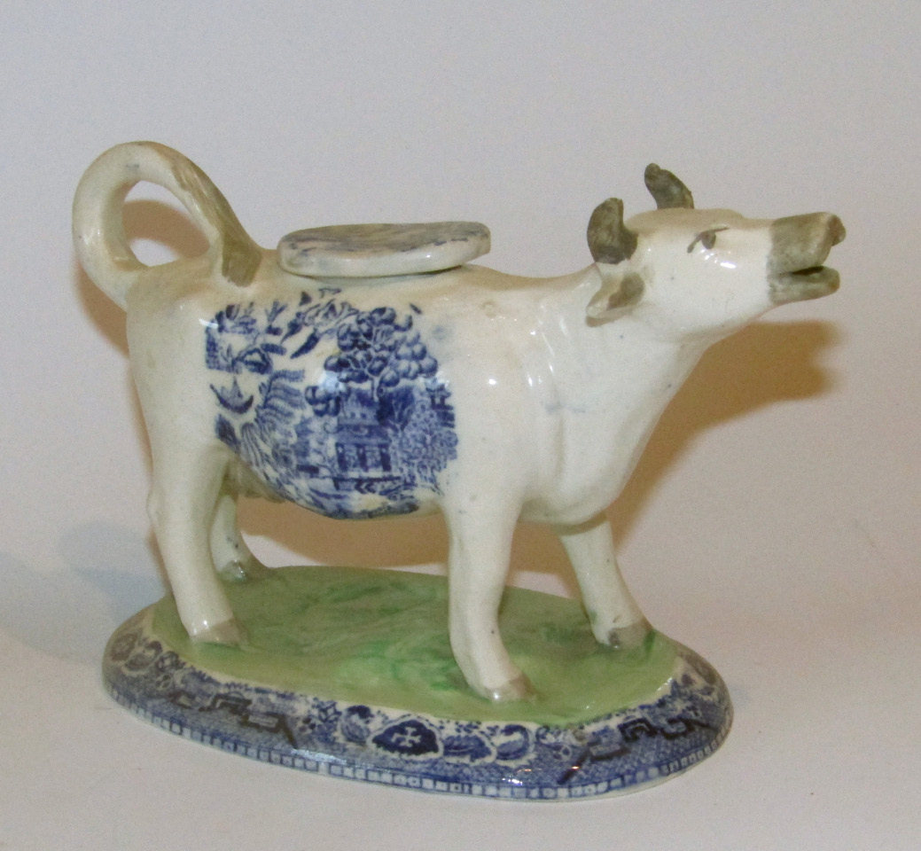 Appraisal: A thC Staffordshire Willow pattern cow creamer in standing pose